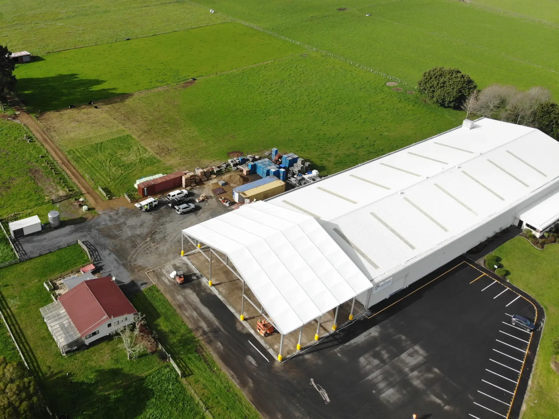 Aerial view of a PCS clear-span canopy extending an existing warehouse building